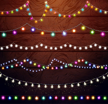 Christmas lights set, colored garlands, New Year design,festive decorations on wooden background. Flat vector illustration, wood texture. Separated editable elements under masks, brushes for creation.