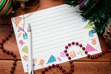 Beautiful blank sheet for letters to Santa for Christmas. Paper and pen next to Christmas...