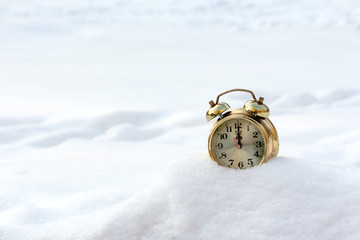 old clock in the pure white snow
