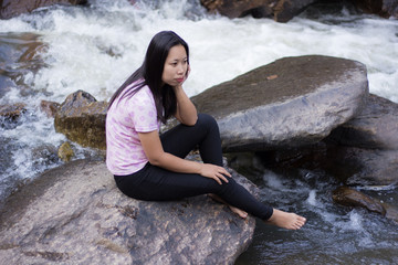 Thai woman with Mae Ya waterfall, Chiangmai Thailand