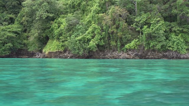 Boat trip to tropical islands. View on beautiful turquoise sea and rocks