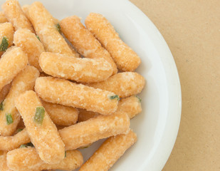 Fried sweet crispy doug in bowl,closeup shot.