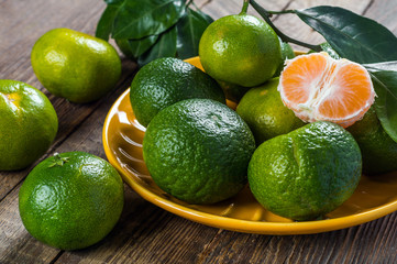 Tangerines on wooden background