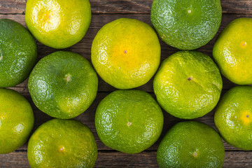 Tangerines on wooden background