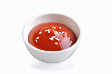 bowl of red tomato sauce ,ketchup on white