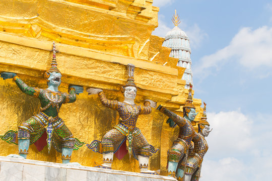 Closeup beautiful Golden Giant in Wat Phra Kaew or the Temple of the Emerald Buddha or Wat Phra Sri Rattana Satsadaram, Bangkok Thailand.