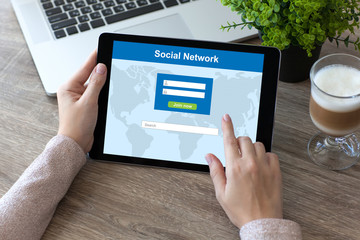 woman hands holding tablet PC computer with social network