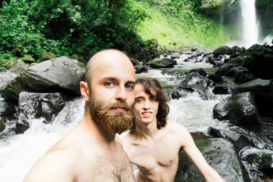 Selfie against waterfall.