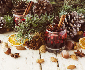 Obraz na płótnie Canvas New Year or Christmas composition with walnuts, mulled wine, hazelnuts