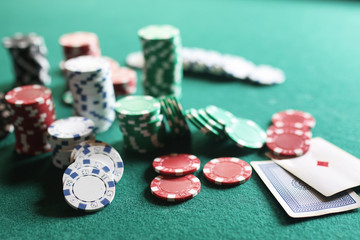 Poker chips and cards on the cloth