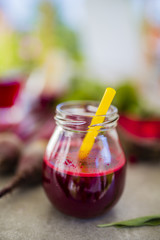Beetroot juice in a jar  on grey stone background. Detox and healthy diet.