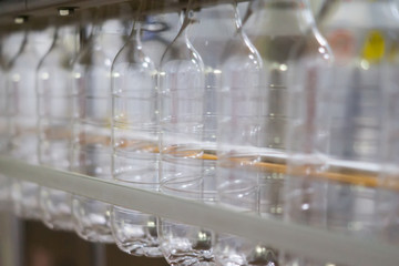 A line of empty plastic bottles ready to run their finished prod