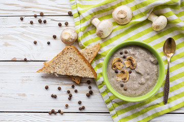 Mushroom puree soup with allspice, parsley, champignons and toas