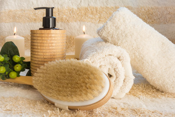 Cozy SPA setting ready for massage with the natural brush and oi