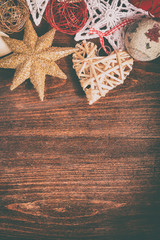 Different type of christmas decoration on wooden background