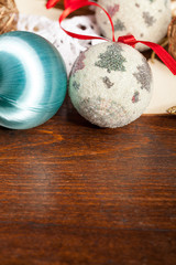 Obraz na płótnie Canvas Christmas balls decorations on wooden table