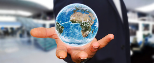 Man holding the planet earth in his hand