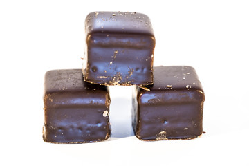 Lebkuchen cookies filled with marzipan, apricot jelly, covered with icing of dark chocolate