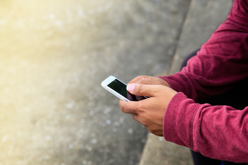 Photographer using mobile smart phone.