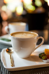 Hot coffee late in beautiful cup at the coffee shop