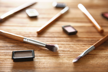 Professional make-up accessories on wooden table