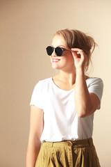 Fototapeta premium Beautiful fashion girl on color background