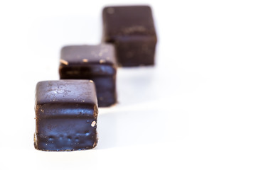 Lebkuchen cookies filled with marzipan, apricot jelly, covered with icing of dark chocolate