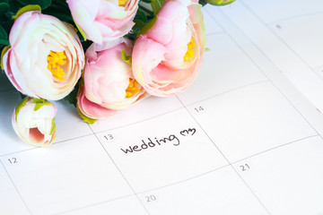 word wedding on calendar with sweet flowers   ,love concept