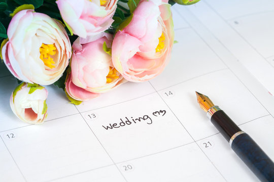  word wedding on calendar with sweet flowers and pen  ,love conc