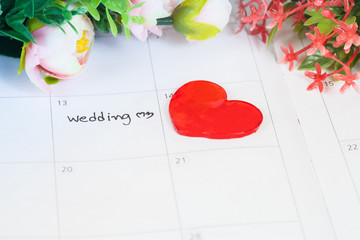 word wedding on calendar with sweet flowers   ,love concept