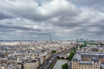 Fototapeta na wymiar Eiffel tower over Paris, cloudy day