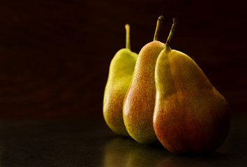 Tasty pears on a dark background