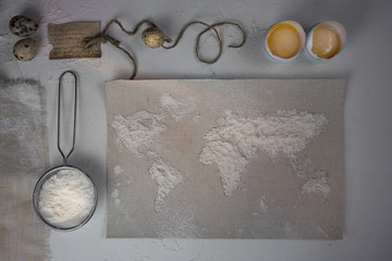 wheat flour in the form of a world map. Food vintage. top view. overhead horizontal.