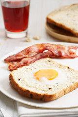 egg in a hole and crispy bacon