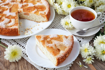 Delicious apple pie and tea on old blackboard