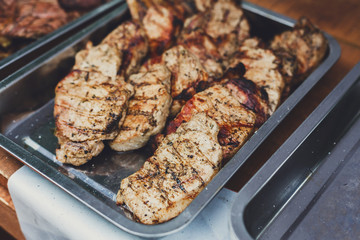 Grill steaks on metal grate, barbecue