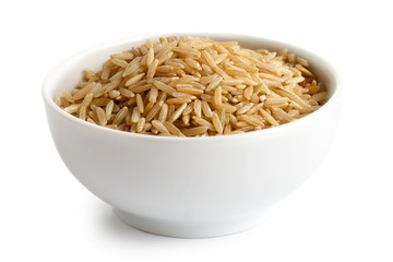 Bowl of long grain brown rice isolated on white.