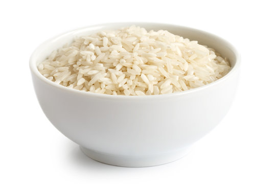 Bowl of long grain white rice isolated on white.