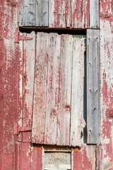 Close up the old door of rust barn in agriculture farmland.