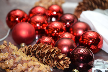 Christmas background with baubles and natural scenery, shallow d