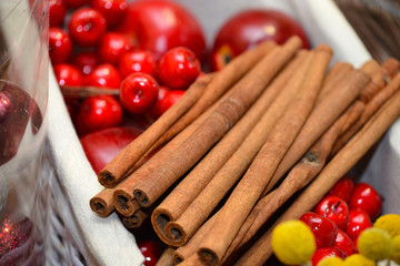 Natural Christmas background with cinnamon and berries closeup