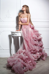 Portrait of a fashion woman in gorgeous long pink dress