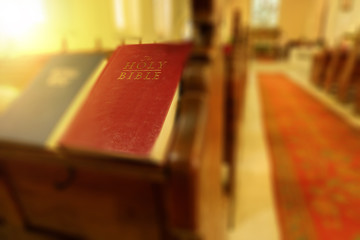 Abstract picture of holy bible with blurred church background