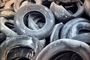 Stack of old car tires, close-up shot.