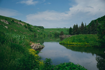 Fototapeta na wymiar lake with green hills