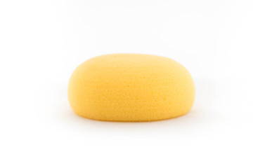 Yellow sponge for baby on white background