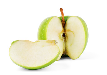 green apple cut in half on white background
