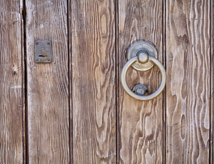 vintage wooden door bronze handle closeup