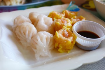 Mixed dim sum or dumplings with seasoning sauce