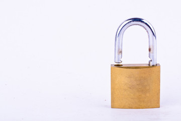  old brass padlock or master key on white background tool isolated
